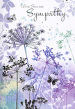 This sympathy card reads like a soft-spoken condolence, the kind you might offer a neighbour in Herne Hill after walking together through Brockwell Park at twilight. The artwork shows a scatter of wild, umbelliferous flowers, their fine stems stretching upward with unhurried grace. Each one supports a delicate cluster of tiny blooms spreading out in a filigree canopy, painted in cool shades of lavender, dusky indigo, and smoky blue. Gentle touches of silvery green drift through the stems and leaves, giving the scene a natural, meadow-like feeling without becoming dense or busy. The petals are rendered with a loose watercolour hand, edges blurred and softened so they look as though they could sway in the faintest breeze. Between the blossoms, several butterflies appear, their wings light and almost see-through, as if they are just brushing the air. They add a quiet sense of presence and transformation, a reminder that even in loss, something gentle endures. Behind this, the background flows in soft gradients of pale purple and blue-grey, with no strong lines to break the calm-just a soothing wash of colour that cradles the flowers. The overall impression is one of humility and heartfelt care, like a modest yet beautifully arranged sympathy bouquet arriving at a family home off Half Moon Lane or near Milkwood Road. Designed with the sensitivity of a local florist from Flower Delivery Herne Hill, the card offers not only words of condolence but a tender visual space where the recipient can pause, reflect, and feel quietly supported.